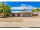 Single-story house with a gray garage door and desert landscaping at 5648 W Folley St, Chandler, AZ 85226