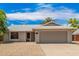 House exterior showcasing a two car garage and a well-maintained front yard at 5648 W Folley St, Chandler, AZ 85226