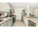 Modern kitchen with light green cabinets and stainless steel appliances at 5648 W Folley St, Chandler, AZ 85226