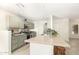 Kitchen with light green cabinets, granite counters, and stainless steel appliances at 5648 W Folley St, Chandler, AZ 85226