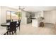 Eat-in kitchen with light green cabinets and granite countertops at 5648 W Folley St, Chandler, AZ 85226