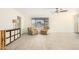 Living room with tile floors, two armchairs, and a ceiling fan at 5648 W Folley St, Chandler, AZ 85226