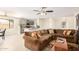 Spacious living room, brown sectional sofa, open to kitchen at 5648 W Folley St, Chandler, AZ 85226