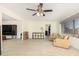 Spacious living room featuring tile floors and a ceiling fan at 5648 W Folley St, Chandler, AZ 85226