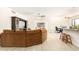 Open living space with brown sectional sofa and kitchen view at 5648 W Folley St, Chandler, AZ 85226