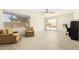 Living area with sliding door to backyard and ceiling fan at 5648 W Folley St, Chandler, AZ 85226