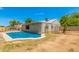Relaxing kidney shaped pool with surrounding yard at 5648 W Folley St, Chandler, AZ 85226