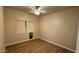 Simple bedroom with wood floors and window at 5937 E Jensen St, Mesa, AZ 85205