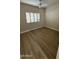 Bedroom with wood floors and plantation shutters at 5937 E Jensen St, Mesa, AZ 85205