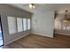 Bright dining area with wood floors and plantation shutters at 5937 E Jensen St, Mesa, AZ 85205