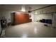 Garage with built-in cabinets and epoxy floor at 5937 E Jensen St, Mesa, AZ 85205