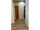 Hallway with wood floors and built-in storage at 5937 E Jensen St, Mesa, AZ 85205