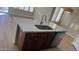 Kitchen island with sink, dishwasher, and ample counter space at 5937 E Jensen St, Mesa, AZ 85205