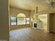 Bright living room featuring a fireplace and large window at 5937 E Jensen St, Mesa, AZ 85205