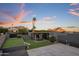 Landscaped backyard with putting green and outdoor seating at 7223 N Black Rock Trl, Paradise Valley, AZ 85253