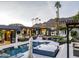 Expansive backyard oasis with a pool, spa, and lounge area at 7223 N Black Rock Trl, Paradise Valley, AZ 85253