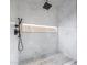 Modern shower with marble tile, linear drain, and LED lighting at 7223 N Black Rock Trl, Paradise Valley, AZ 85253