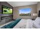 Bright bedroom with fireplace, large window, and mountain views at 7223 N Black Rock Trl, Paradise Valley, AZ 85253