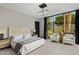 Bright bedroom with sliding glass doors and sitting area at 7223 N Black Rock Trl, Paradise Valley, AZ 85253