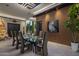 Contemporary dining room with glass table and modern chairs at 7223 N Black Rock Trl, Paradise Valley, AZ 85253