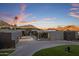 Contemporary home exterior with mountain views at sunset at 7223 N Black Rock Trl, Paradise Valley, AZ 85253