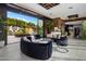 Relaxing game room with comfortable seating and views of the backyard pool at 7223 N Black Rock Trl, Paradise Valley, AZ 85253