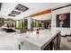 Luxury kitchen features a large marble island and modern lighting at 7223 N Black Rock Trl, Paradise Valley, AZ 85253