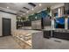 Modern kitchen with large island, stainless steel appliances, and skylights at 7223 N Black Rock Trl, Paradise Valley, AZ 85253