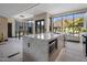 Modern kitchen with marble island, breakfast bar, and mountain views at 7223 N Black Rock Trl, Paradise Valley, AZ 85253