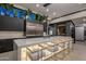 Luxury kitchen with large marble island and bar seating at 7223 N Black Rock Trl, Paradise Valley, AZ 85253