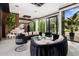 Elegant living room with floor-to-ceiling windows and modern furniture at 7223 N Black Rock Trl, Paradise Valley, AZ 85253