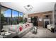 Relaxing living room with large windows and wood accent wall at 7223 N Black Rock Trl, Paradise Valley, AZ 85253
