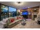 Living area with large aquarium and comfortable seating at 7223 N Black Rock Trl, Paradise Valley, AZ 85253