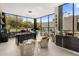Home office with large windows, modern desk, and stylish chairs at 7223 N Black Rock Trl, Paradise Valley, AZ 85253