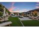 Resort-style pool and patio area with plenty of lounge chairs and umbrellas at 7223 N Black Rock Trl, Paradise Valley, AZ 85253