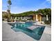 Luxury pool with spa, pergola, and ample lounge space at 7223 N Black Rock Trl, Paradise Valley, AZ 85253