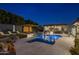 Inviting pool and spa area with a pergola and plenty of seating at 7223 N Black Rock Trl, Paradise Valley, AZ 85253