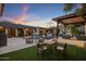 Inviting pool and patio area with a wooden dining table set at 7223 N Black Rock Trl, Paradise Valley, AZ 85253