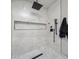 Clean shower with marble tile and niche at 7223 N Black Rock Trl, Paradise Valley, AZ 85253