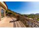Expansive balcony features stone flooring and decorative metal railing offering panoramic views at 7929 N 55Th St, Paradise Valley, AZ 85253
