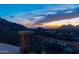 Balcony view with iron railing overlooks the lights of the city and mountain silhouettes at 7929 N 55Th St, Paradise Valley, AZ 85253