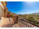 Expansive balcony with wrought iron railings offering panoramic views of the picturesque desert landscape at 7929 N 55Th St, Paradise Valley, AZ 85253