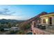 Balcony view of the city at dusk, showcasing the valley and a mountain backdrop at 7929 N 55Th St, Paradise Valley, AZ 85253