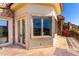 Elegant balcony with travertine flooring, iron railings, and serene views of the surrounding landscape at 7929 N 55Th St, Paradise Valley, AZ 85253