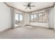 Bright bedroom with large windows and a French door to a balcony, offering stunning mountain views at 7929 N 55Th St, Paradise Valley, AZ 85253