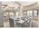 Elegant formal dining room features natural light, pool views, and mountain views for luxury entertaining at 7929 N 55Th St, Paradise Valley, AZ 85253