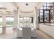 Bright formal dining room features mountain views, large windows, and seating for twelve for elegant entertaining at 7929 N 55Th St, Paradise Valley, AZ 85253