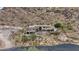 View of luxury home with a private drive on a hillside showing construction and landscaping at 7929 N 55Th St, Paradise Valley, AZ 85253