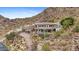 Expansive hillside home boasts a private drive, tile roof, balconies and refreshing pool at 7929 N 55Th St, Paradise Valley, AZ 85253