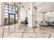 Grand foyer with travertine floors, high ceilings, custom iron door, and an open floor plan at 7929 N 55Th St, Paradise Valley, AZ 85253